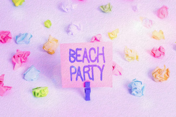 Writing note showing Beach Party. Business concept for large group of showing are organizing an event at the beach Colored crumpled paper empty reminder white floor clothespin