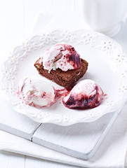 Brownie with Ice Cream. White wooden background. 
