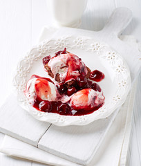 Brownie with Ice Cream. White wooden background.