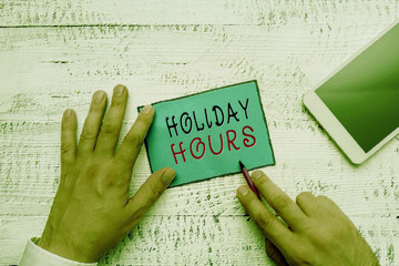 Conceptual hand writing showing Holiday Hours. Concept meaning employee receives twice their normal...