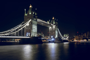 Fototapeta na wymiar Tower Bridge Illuminated at Night in London, UK