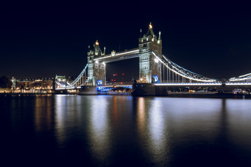 Fototapeta na wymiar Tower Bridge Illuminated at Night in London, UK