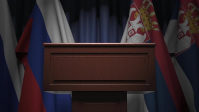 Many flags of Serbia and Russia behind speaker tribune, 3D animation