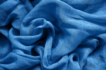 Blue cotton fabric background. Color of the year 2020 classic blue toned. - obrazy, fototapety, plakaty