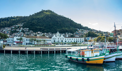 Fototapeta na wymiar View of the port and city of Angra dos Reis with boats and pier for landscaping, state of Rio de Janeiro Brazil South America