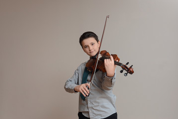 Boy playing viola wearing shirt and tie - obrazy, fototapety, plakaty