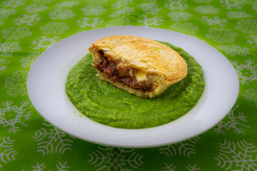 Beef pie with mushy peas