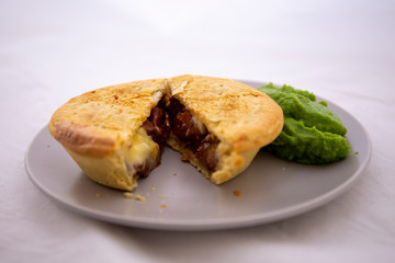 Beef pie with mushy peas