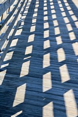 Shadow on wooden bridge