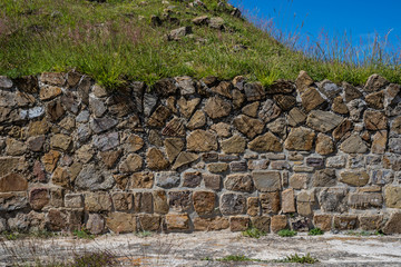 stone wall with vegetation