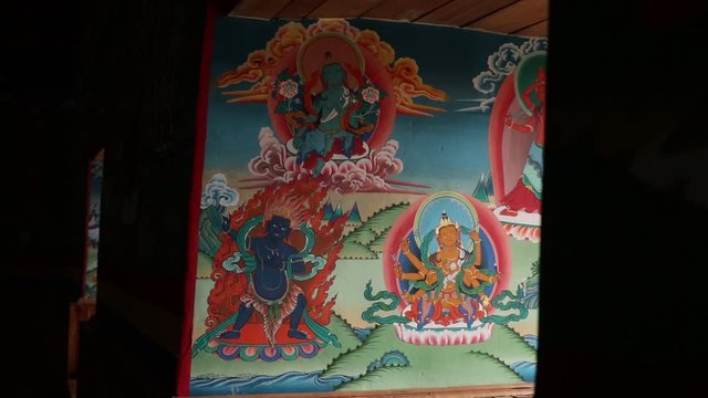 tibetan murals on the entrance of a monastery in ladakh