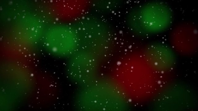 Abstract Seamlessly Looping Video features snow falling backed by colorful red and green blinking Christmas lights in the soft-focus background.