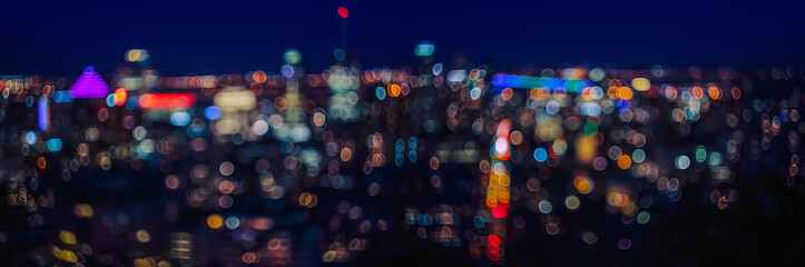 Urban night light bubble bokeh defocused background.