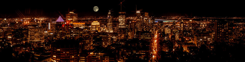 Beautiful night sky over Montreal downtown skyline panorama. Magic moon over Canadian city.