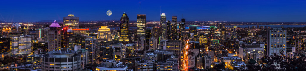 Amazing view of Montreal city at sunset with colorful neon light building.