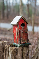 Old wooden red birdhouse