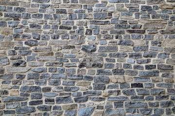 Stone wall texture. Gray stone wall background.