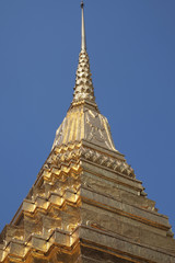 Golden pagoda on blue sky