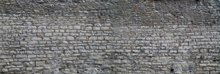 Stone wall texture. Gray stone wall natural background.