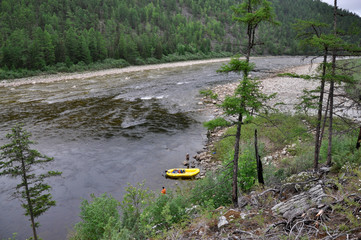 Travelling along the taiga river in Russian Far East