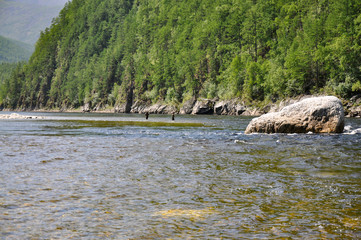 Travelling along the taiga river in Russian Far East