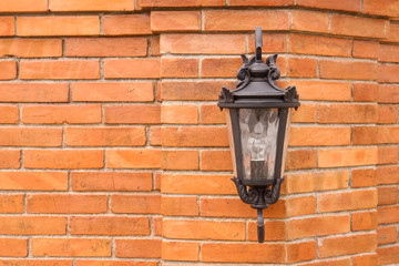 Antique electronic lamp, hanging at the  wall in the building,soft focus.
