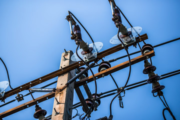 The background of high-voltage electricity poles and wires spread to various locations, energy consumption and lighting used in everyday life