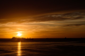 Sunrise in the Strait of Gibraltar with boats.