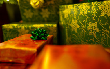 Red-wrapped presents with a green bow