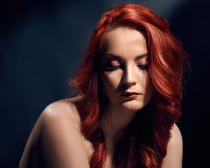 Naklejka premium Sensual beautiful woman with bright evening makeup and stylish hairdo