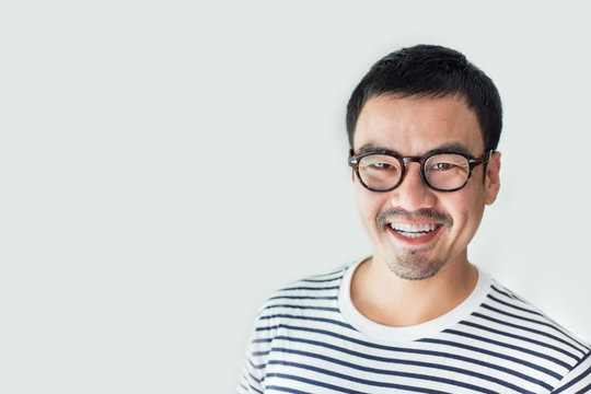 portrait young asian man wear eye glasses Smiling cheerful look thinking position with perfect clean skin posing on white background.fashion people freedom life style concept
