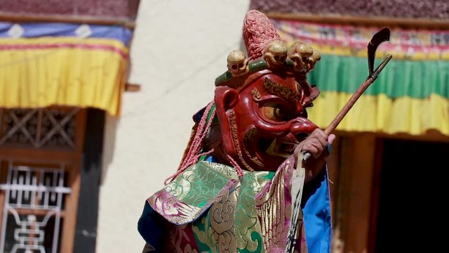 monks performing a mask dance during the festival in a monastery in ladakh