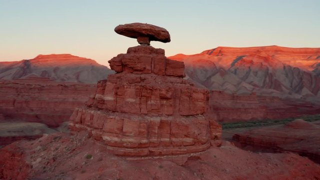 Aerial shot of the incredible balancing Mexican Hat rock formation in Southern Utah.