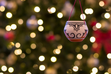ornament hanging in front of blurry background christmas season