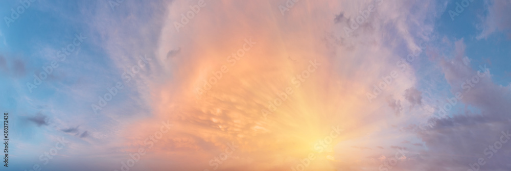Wall mural sunset cloudy sky with the orange sun