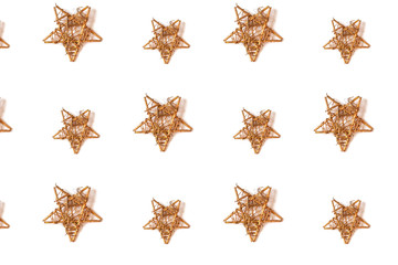 Fototapeta na wymiar Pattern made from gold stars isolated on white background. Festive concept.