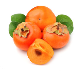 Persimmon fruits with leaves.