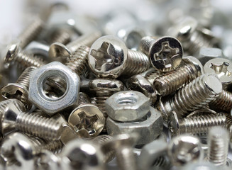 close up marco pile of old metal nuts and bolts on white isolate background - 308376699