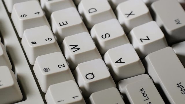 Finger presses nomber 2 or @ button on keyboard