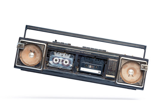 Very dirty shabby and broken old cassette player, isolated on white background. File contains a path to isolation