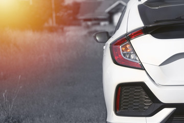Close up Red car taillights look modern with black and white background images.
