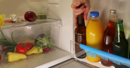 Grabbing a beer from the fridge