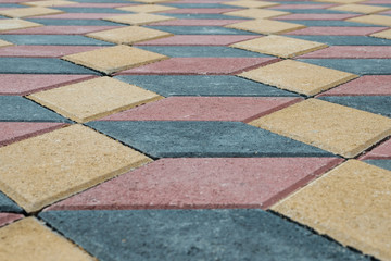 paving tiles with low angle in the form of cubes of different colors perspective