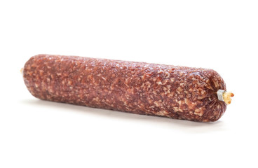 Stick of raw smoked sausage. Close up. Isolated on white background