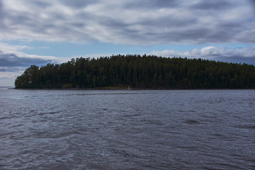 The nature of Karelia.Typical Karelian landscape on the island of Valaam: forest of conifers, Lake Ladoga, crag and volcanic rocks. Russia, Karelia
