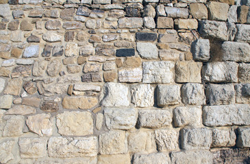 Ancient wall of stone blocks