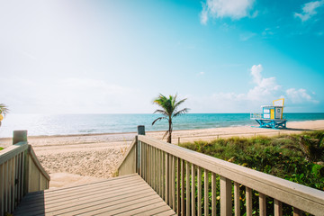 entrance to tropical beach with lifeguard cabin, Florida, USA