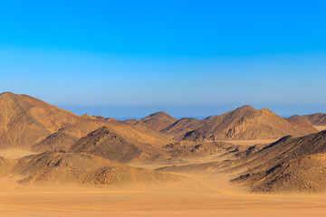 Naklejka na ściany i meble View of Arabian desert and mountain range Red Sea Hills in Egypt