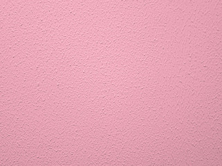 Fototapeta premium Pink textured wall painted pink