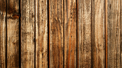 textured surface from old brown wood vertical planks covered with stain